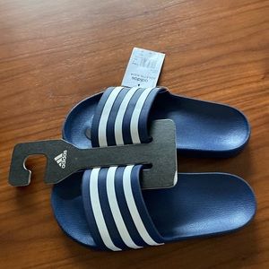 Selling brand new pair of Adidas adilette aqua slides.